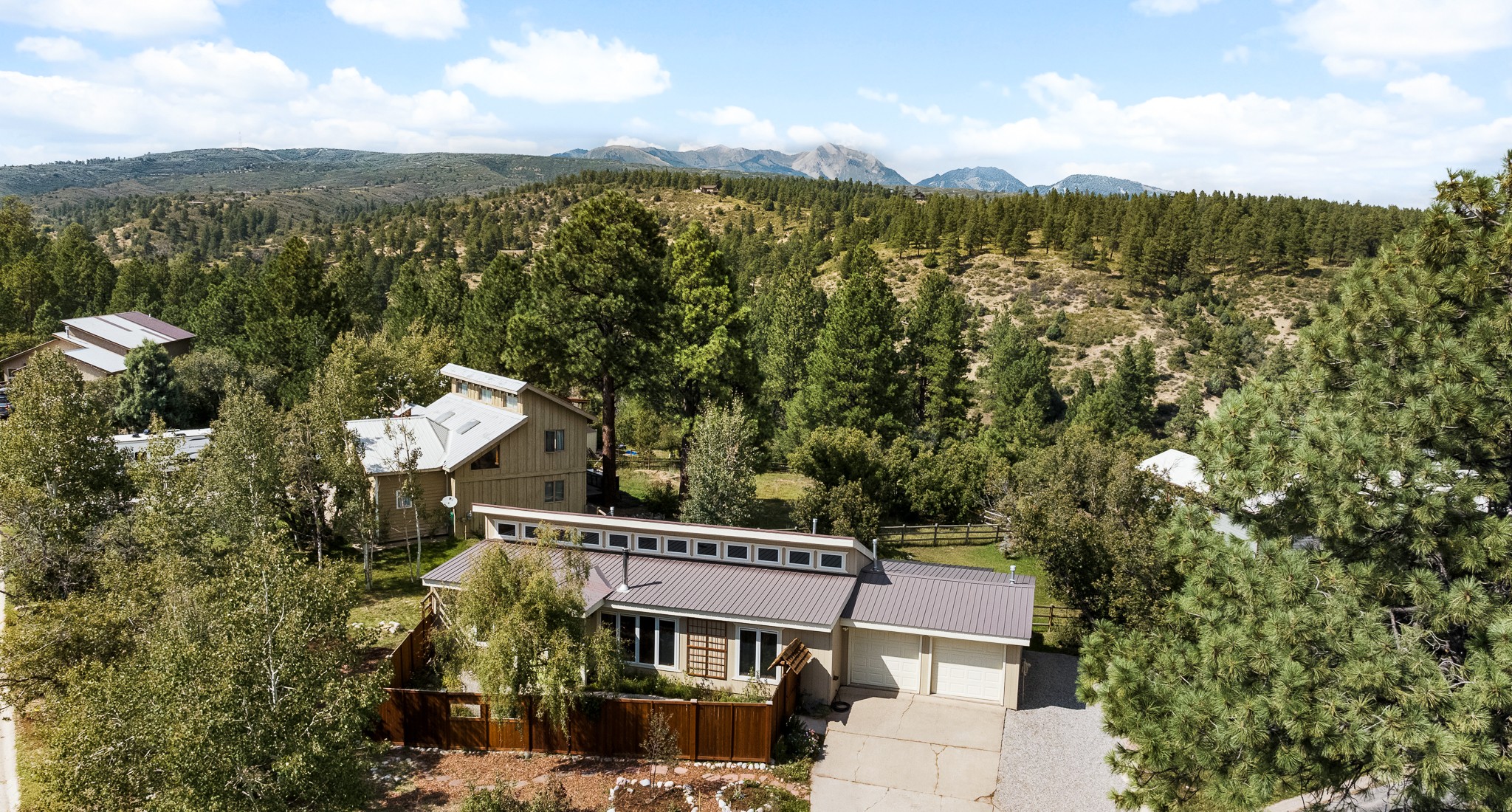 Durango West 2 home for sale in Durango, CO — ranch-style house among ponderosa pines